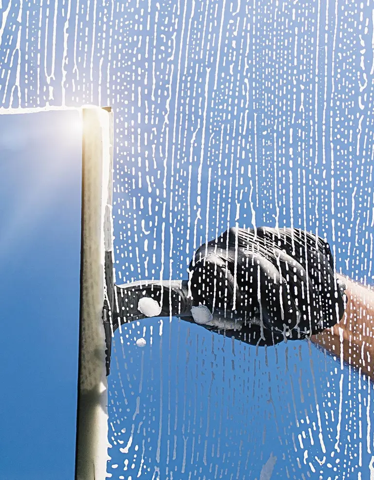 Professional window cleaning with squeegee in Lodi, CA